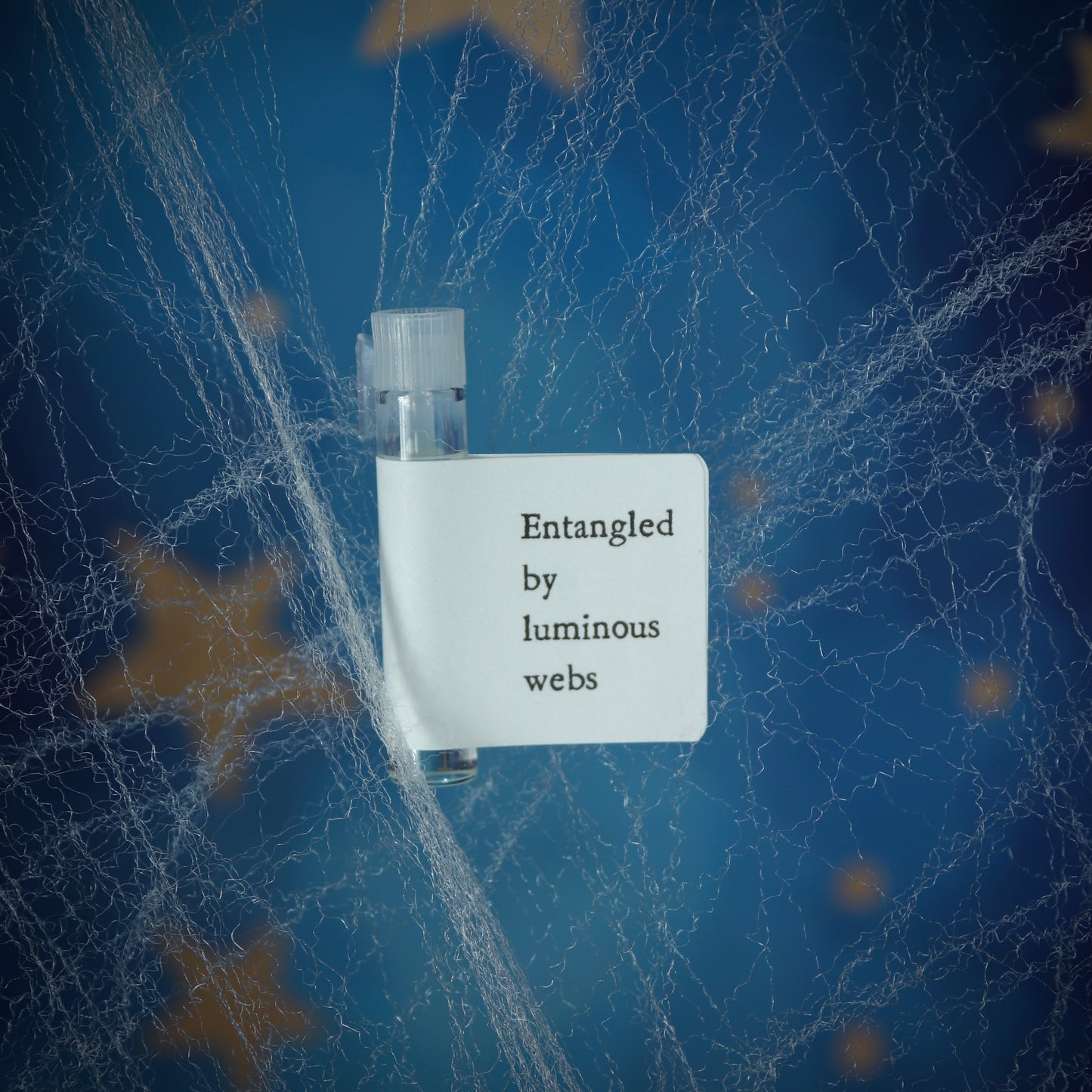 Entangled by luminous webs perfume