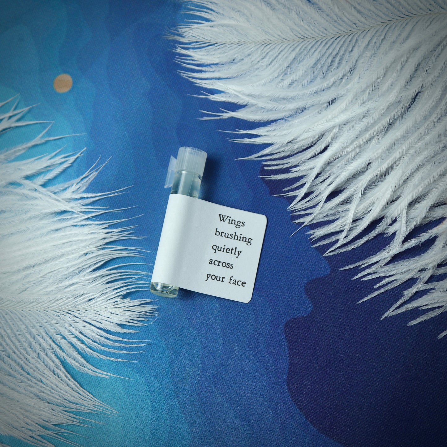 Wings brushing quietly across your face perfume