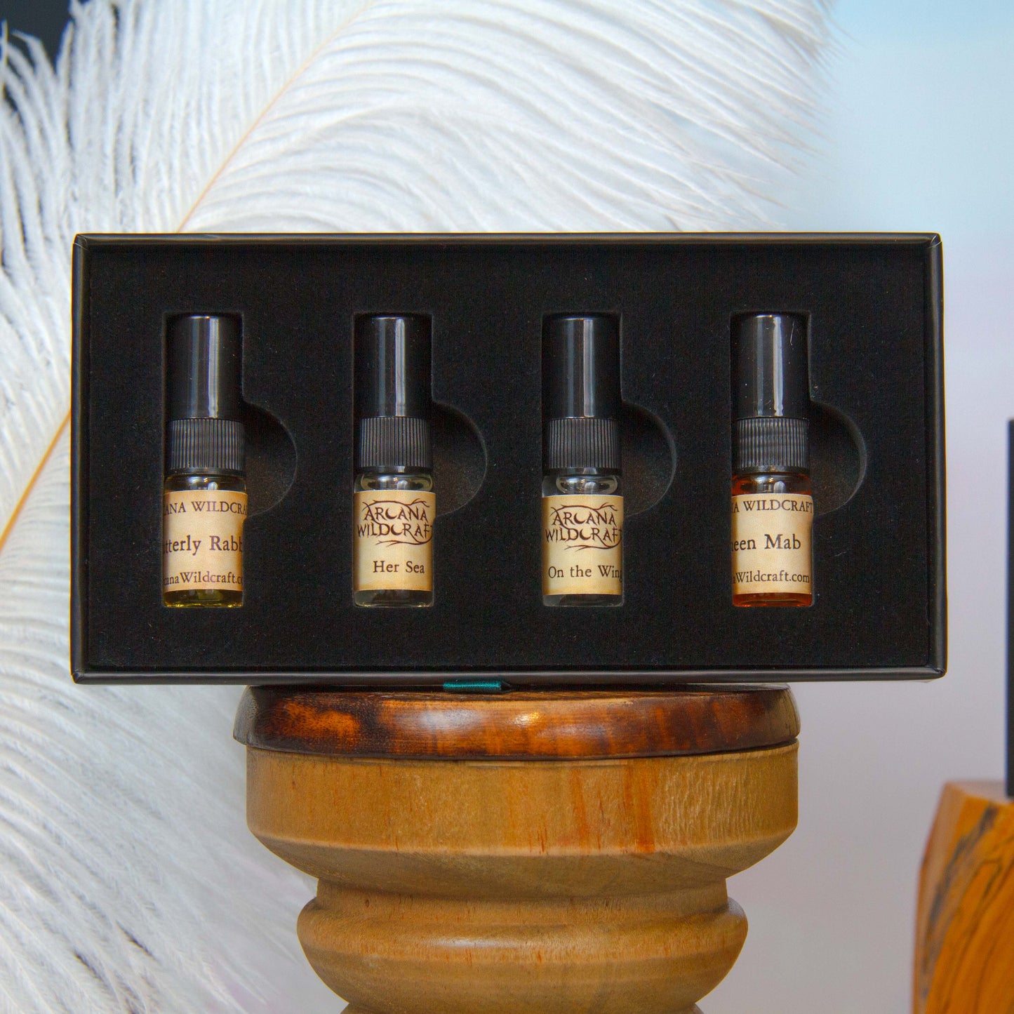 An ethereal discovery set by arcana wildcraft containing 2 ml atomizers of butterfly rabble, her sea, on the wing, and queen mab