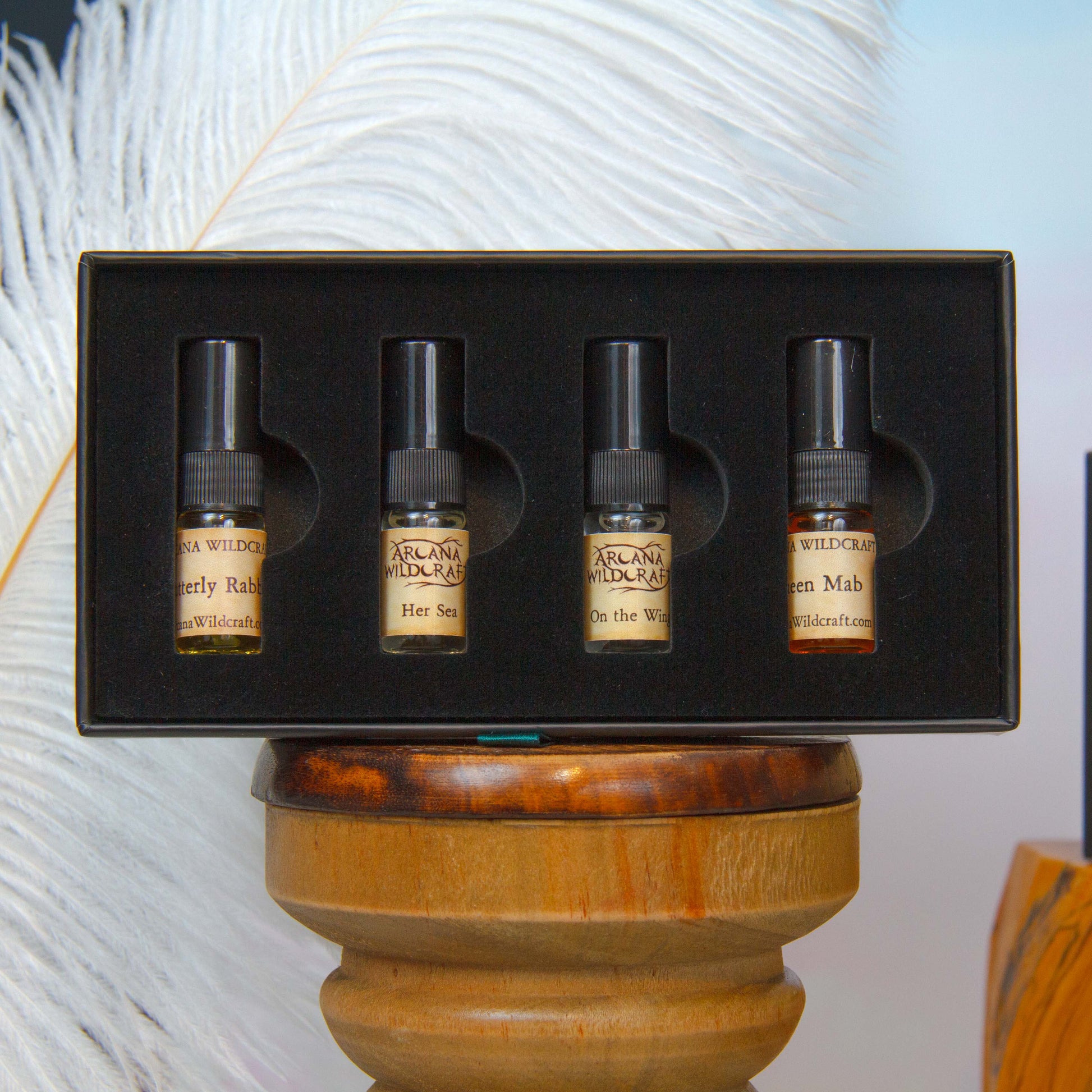 An ethereal discovery set by arcana wildcraft containing 2 ml atomizers of butterfly rabble, her sea, on the wing, and queen mab